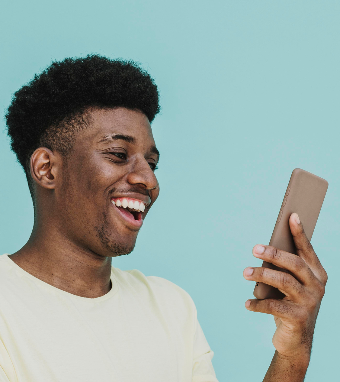 Smiling man using app on mobile phone